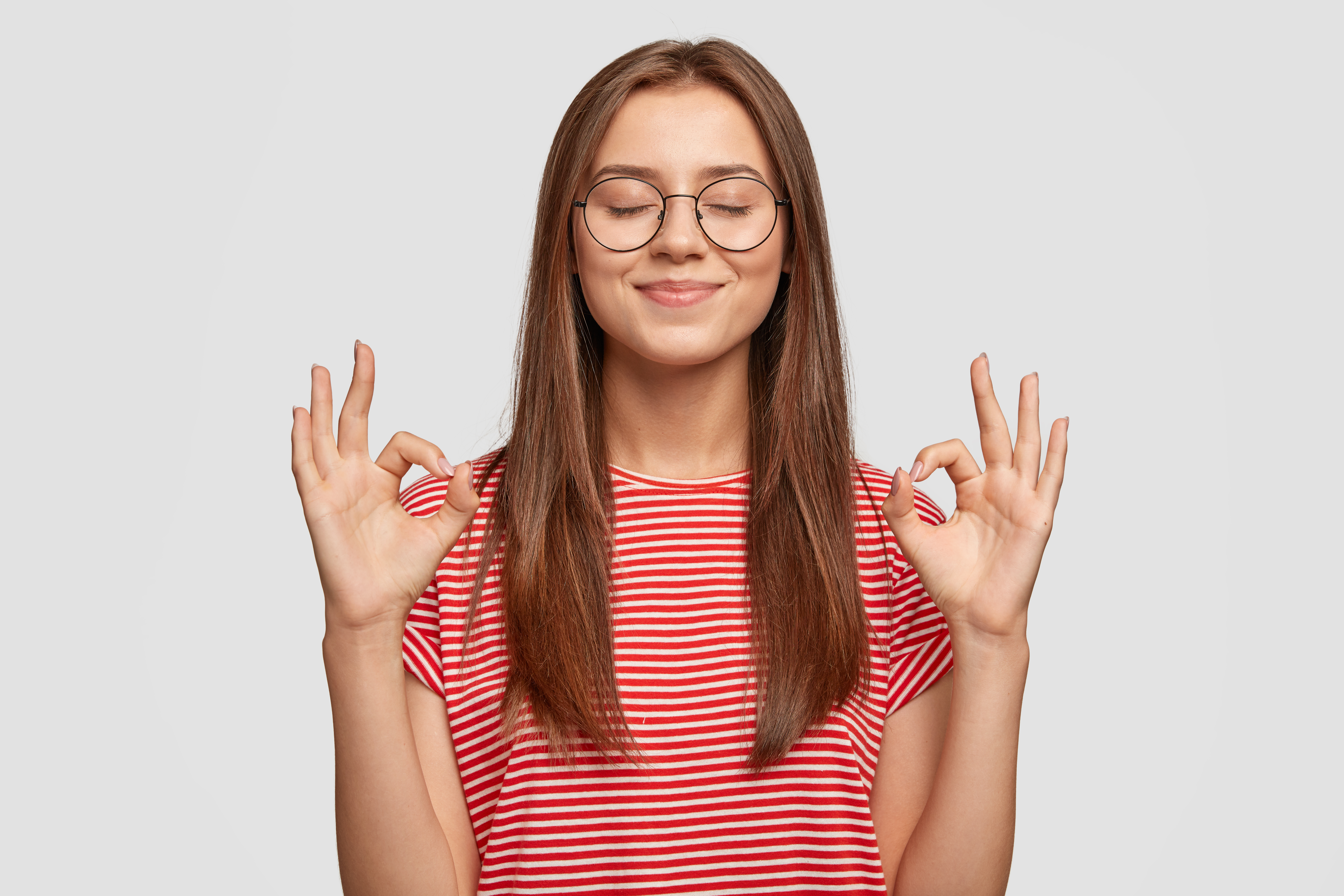Pleased Satisfied Young Female Model Makes Zero Gesture Wears Transparent Glasses Has Long Dark Hair